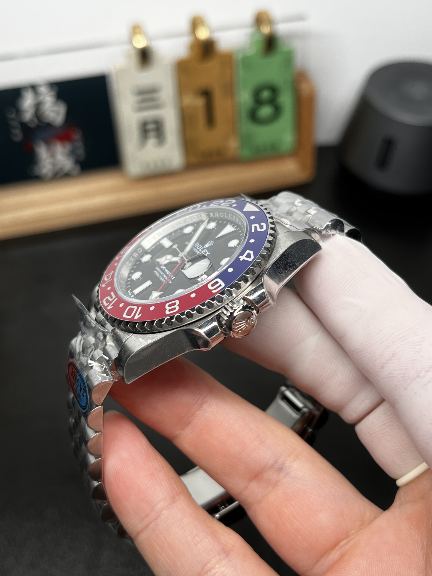 Side profile of GMT Master II Pepsi replica showing case thickness crown and bezel detail